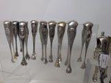 a lot of spoons that are on display in a glass case