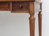 a wooden desk with a drawer on top of it