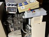 a lot of electrical equipment that are sitting on the floor