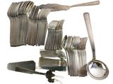 a lot of forks and spoons that are on the table