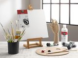 a wooden easel with paint, brushes, and a wooden hand