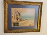 a picture of a painting hanging on the wall above a toilet