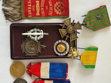 many medals and medals on display on a table