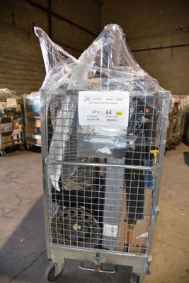 a metal cage with a sign on it in a warehouse
