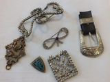 a lot of jewelry on a white table