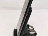 a close up of a cell phone on a stand
