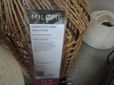 a label on the back of a wicker chair