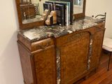a wooden cabinet with a mirror on top of it