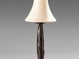 a table lamp with a white shade on top of it