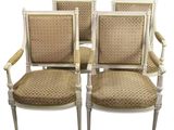 ensemble de quatre fauteuils de style Louis XVI avec assises rembourrées