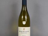 a bottle of wine that is sitting on a table