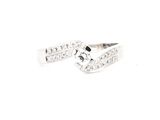 a close up of a diamond ring on a white background