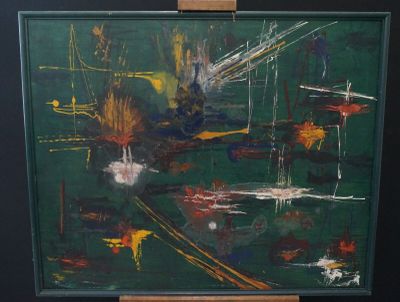 a painting that is on a easel in a room