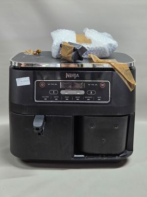 un grille-pain noir sur lequel sont posés tout un tas d'aliments