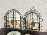 two clocks sitting on a table with a clock on it