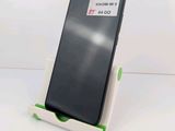 a phone that is sitting on a stand on the table