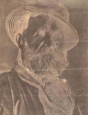 an old picture of a man with a beard and a hat