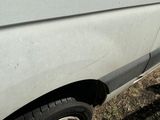 a white van that is parked on the side of the road