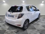a white car that is parked in a room