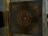 a table with a decorative design on it in a room
