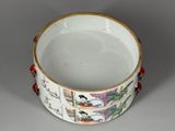 a white bowl with a design on it on a table