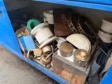 an image of a blue truck with a bunch of items in it
