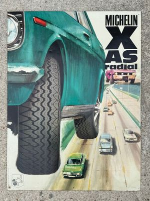 an image of a magazine with a picture of a green car on the cover