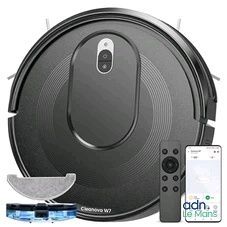 a close up of a robot vacuum cleaner with a remote control