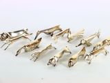 six paires de figurines d'animaux plaquées argent sur un fond blanc