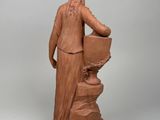 an image of a statue of a man with a beard holding a pot