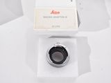 an image of a camera lens with a box on a white surface
