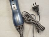 a hair dryer that is sitting on a table