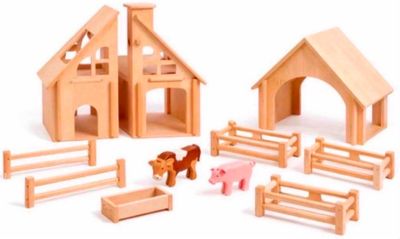 wooden toys that include a barn, a horse, and a barn