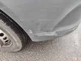 a close up of a car ' s tire on the street