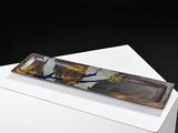 a glass plate on a white box on a black background
