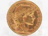 l'image d'une pièce d'or sur laquelle figure le visage d'une femme