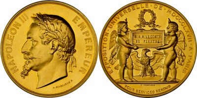 a close up of a gold coin with an image of a man on it