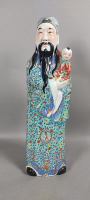 an image of a figurine of a man holding a cat