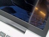 a close up of a laptop screen with a cracked screen