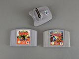 two nintendo game cartridges sitting next to each other on a table