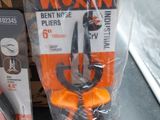 packaging of a pair of scissors sitting on top of a window sill