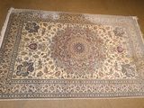 an oriental rug on the floor in a room with a chair