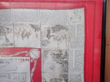 a picture of a picture of an old newspaper in a frame