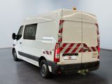 a white van with red stripes parked in a room