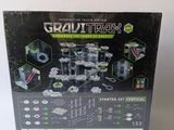 the box is open to show the contents of a toy set