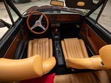dashboard of a car with leather seats and a steering wheel