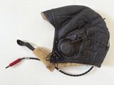 a black leather baseball glove with a brown leather hat on it
