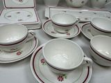 a lot of dishes and cups on the table
