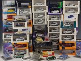 a lot of toy cars that are stacked up together
