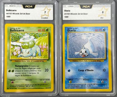 three pokemon cards are displayed in a plastic case on a table